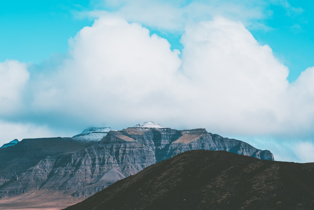 gray and brown mountain under white clouds