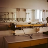Custom dressing room featuring elegant shelving and soft ambient lighting.