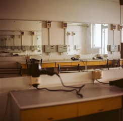 Cozy dressing room with warm lighting and comfortable seating in a basement studio setting.