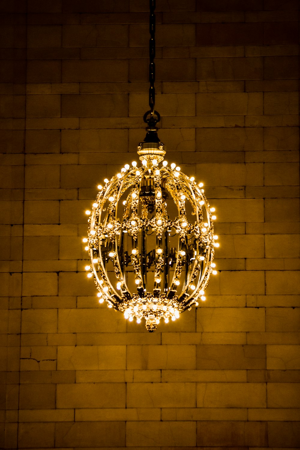 brass-colored pendant lamp