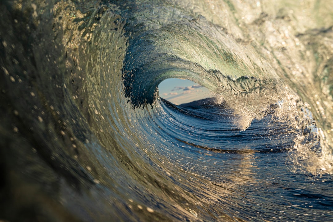 Inside a perfect wave at sunset by Ryan Pernofski