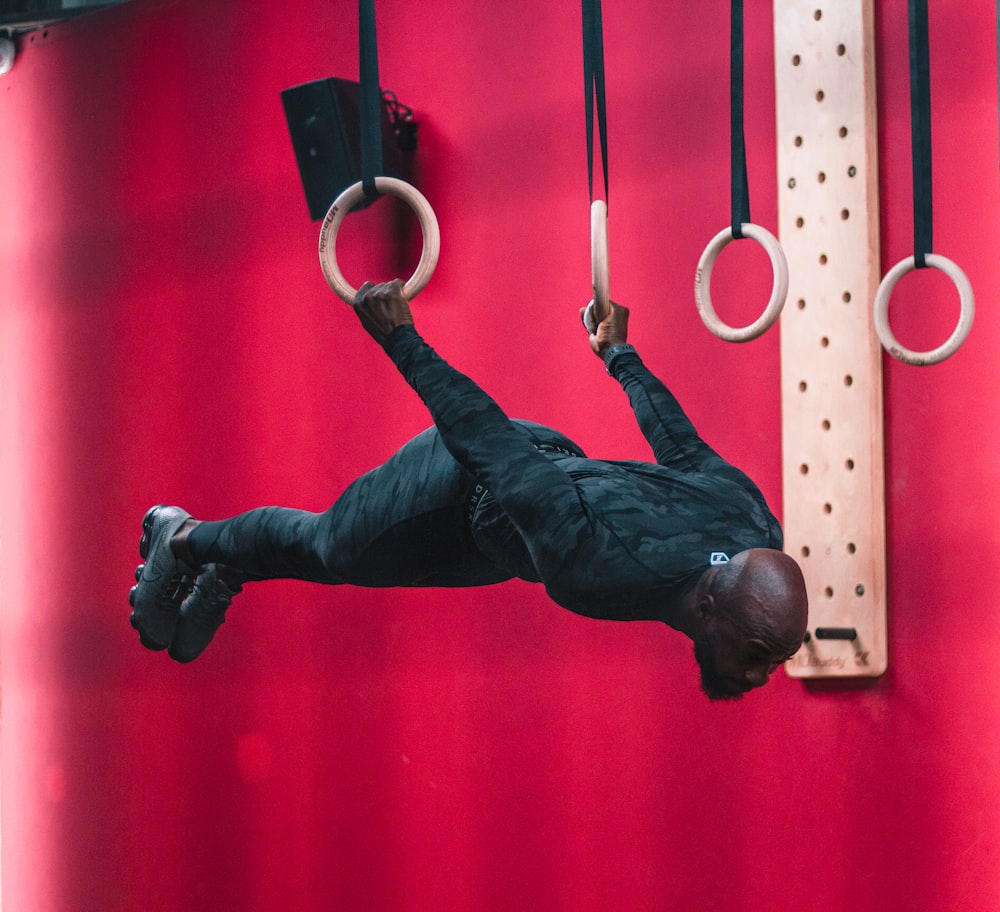 man acrobat on two ring hoops