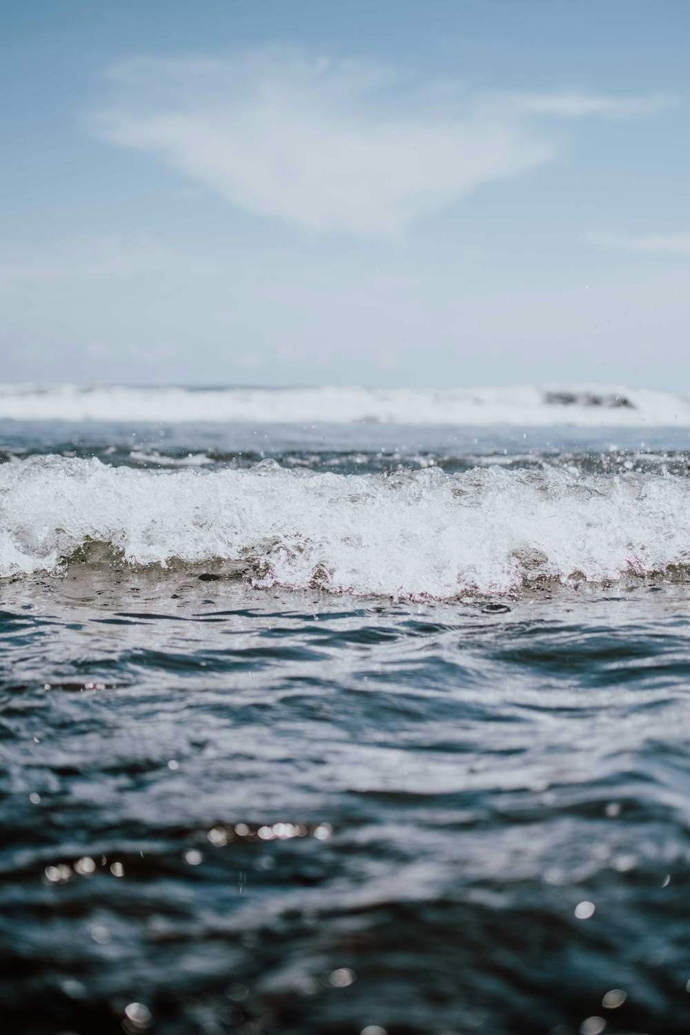 a person riding a surfboard on a wave in the ocean