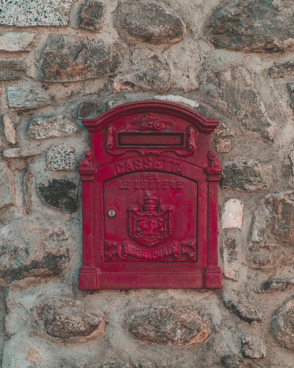 red metal stone wall ornament