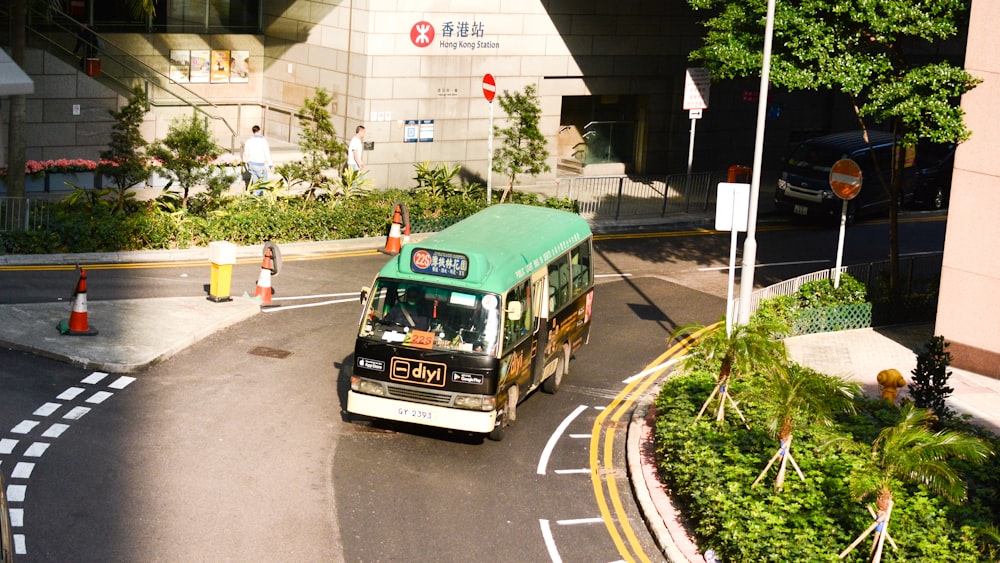 green and black bus during daytime