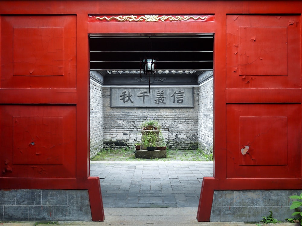 a red building with a sign in the middle of it