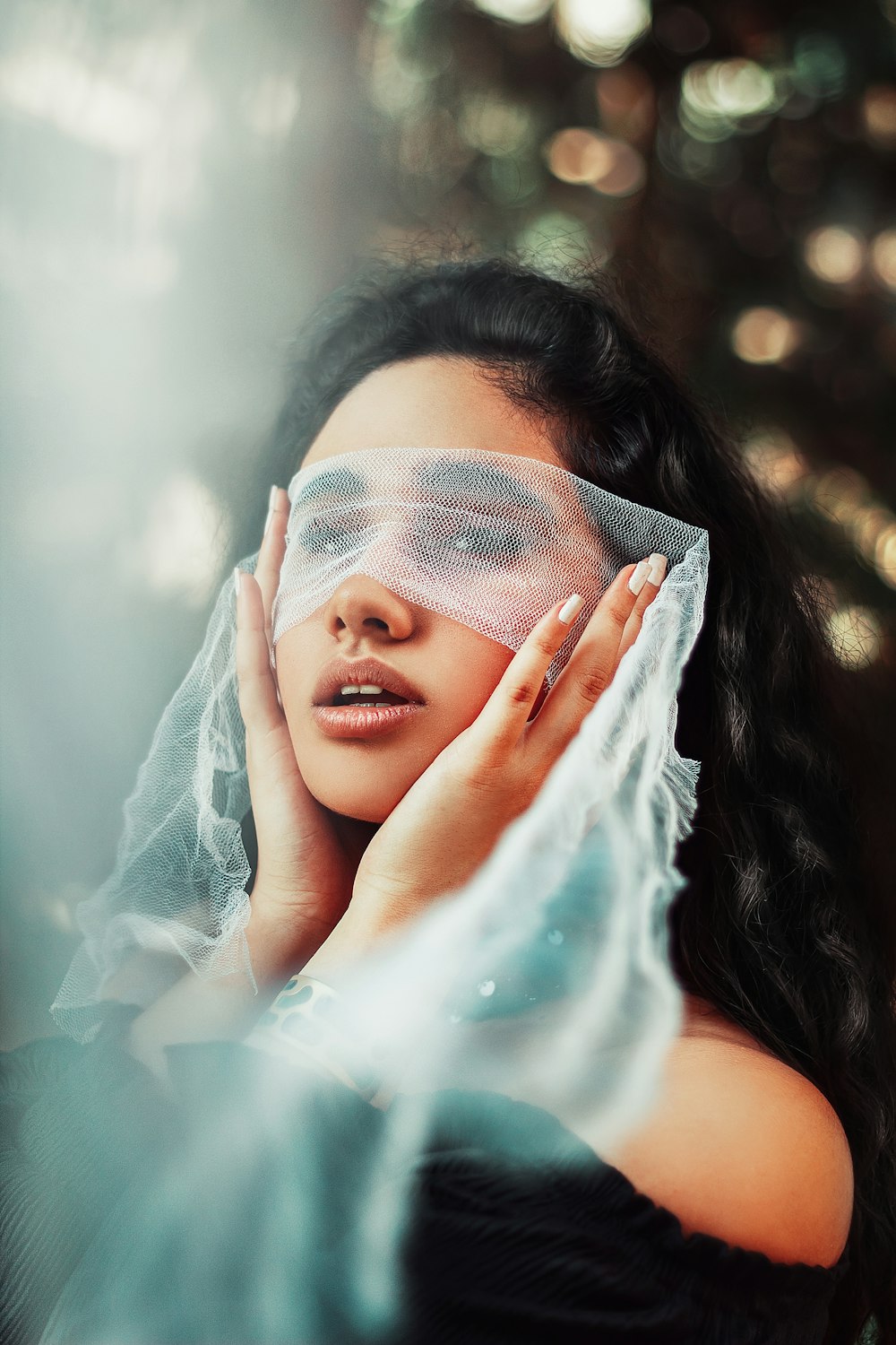 woman touching her face with her hands