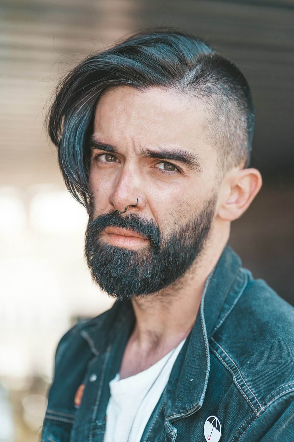 man wearing blue denim jacket