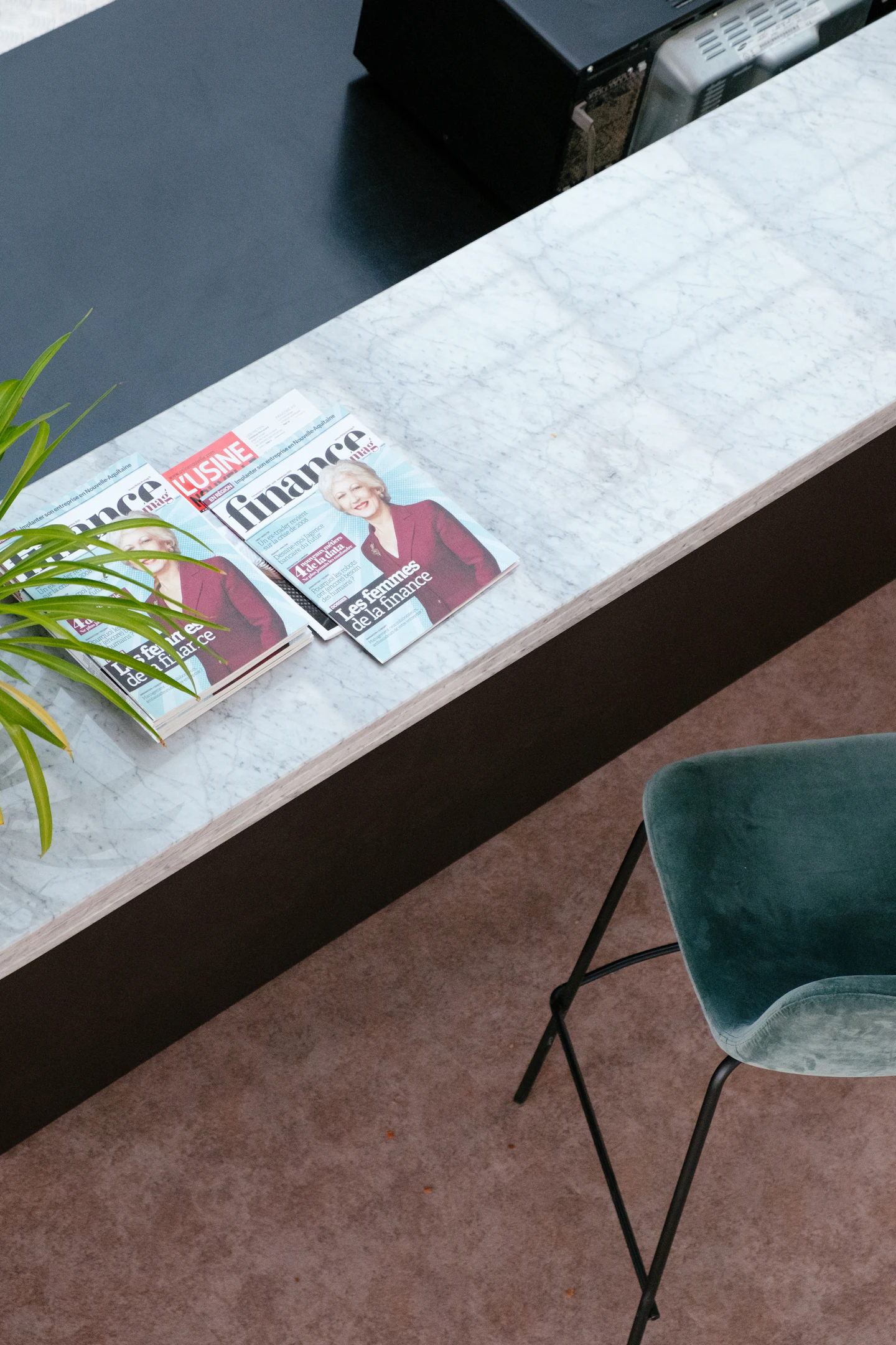 Business and finance magazines arranged across a desk