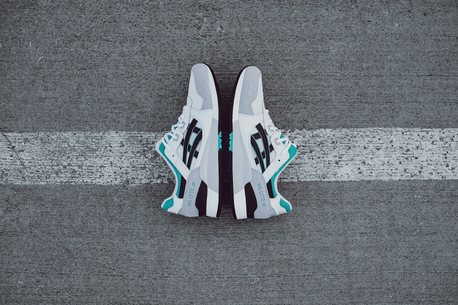 Fujifilm X-T3 + Fujifilm XF 35mm F1.4 R sample photo. White-black-gray-and-teal asics low-top shoes photography