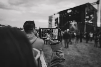 Photo of a confident young professional using a smartphone to securely transfer an event ticket.
