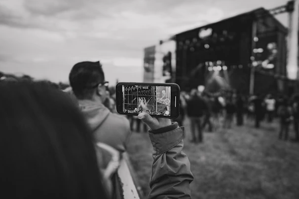Photo of a confident young professional using a smartphone to securely transfer an event ticket.