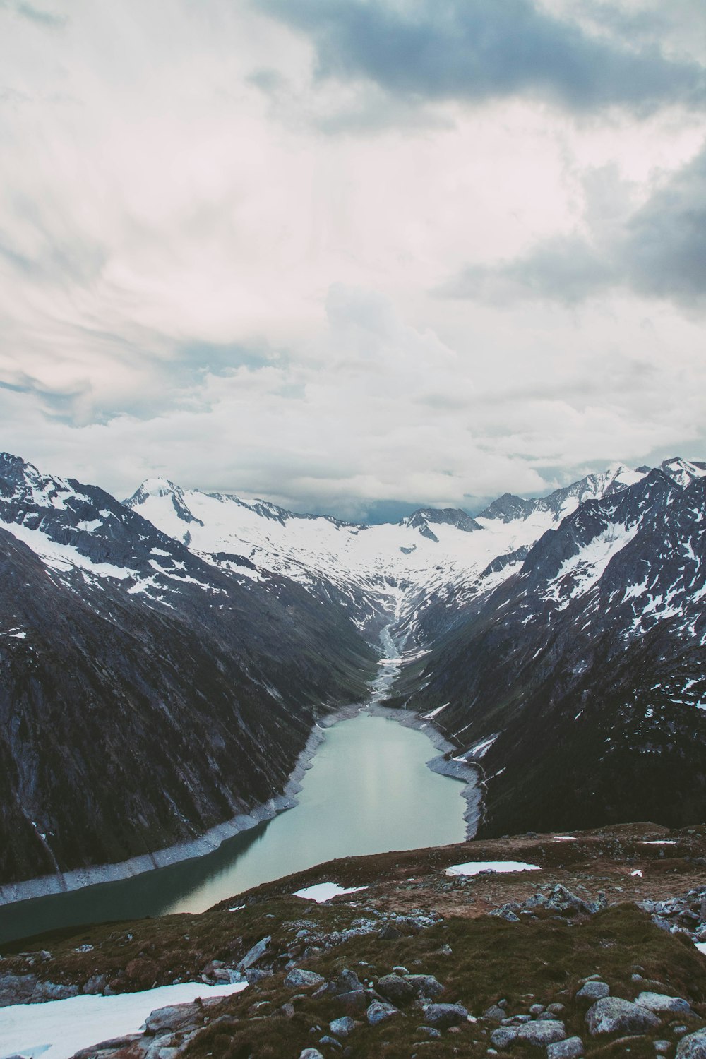 valley and mountain under white sky