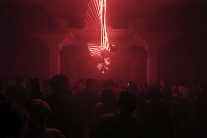 people inside dark room with red light