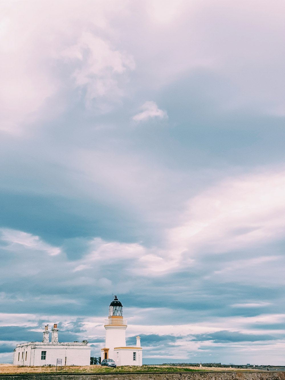 white concrete lighthouse during daytime