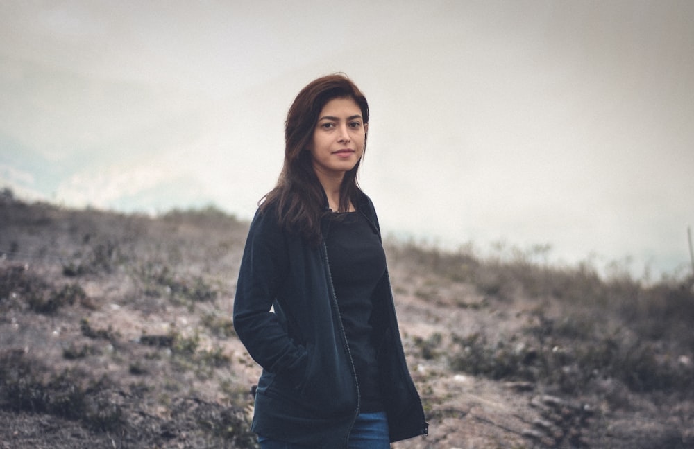 woman standing on grass field