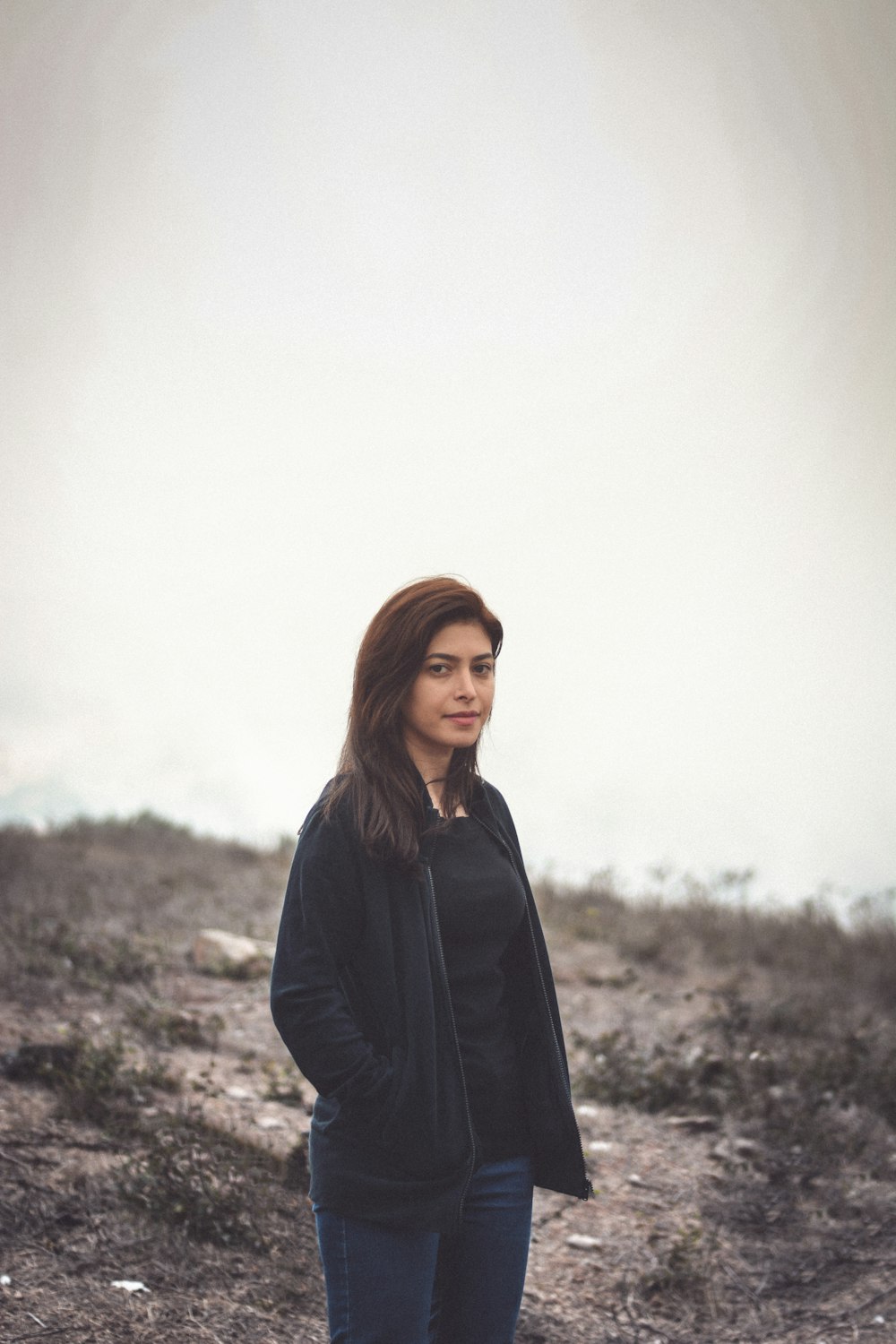 woman standing and smiling during day