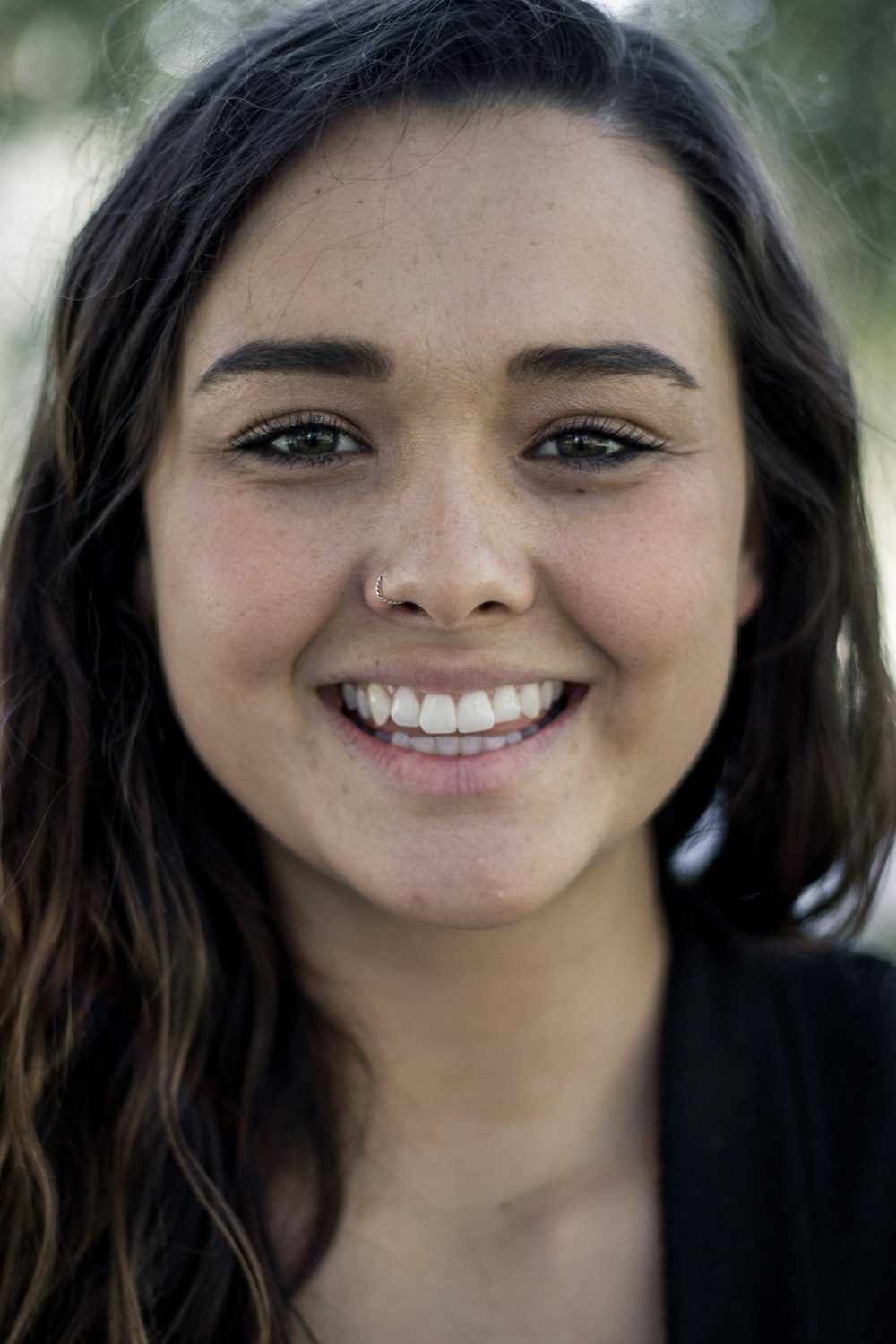 shallow focus photo of woman in black top