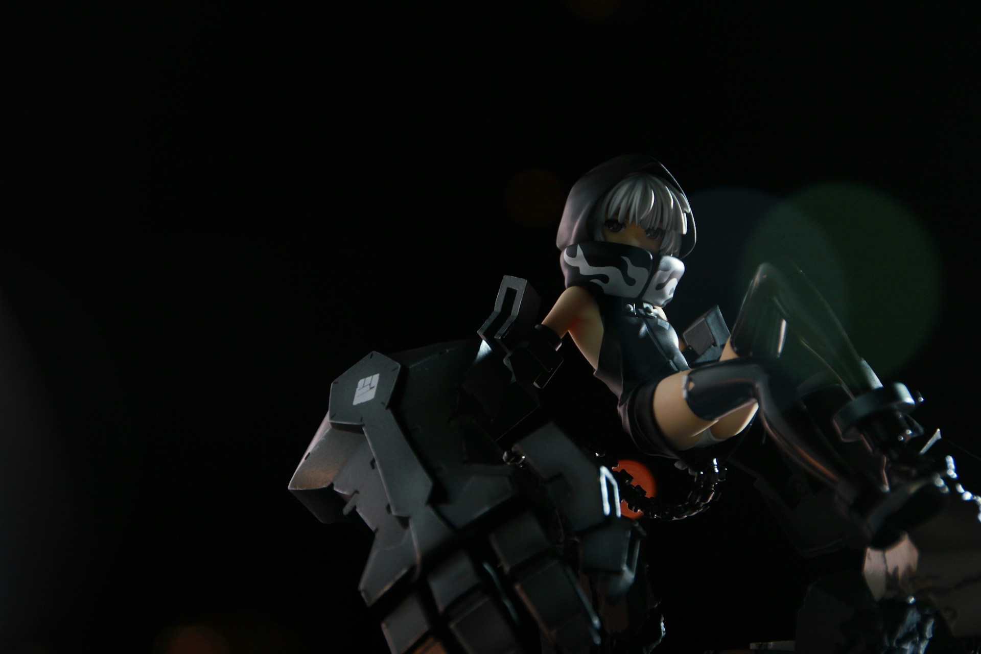 A dark-themed gaming anime male character in a dynamic pose, set against a black background with red accents.