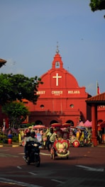 red cathedral under blue sky