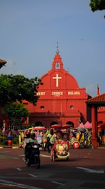 red cathedral under blue sky