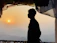A peaceful traveler standing on the Varanasi ghats during sunrise.