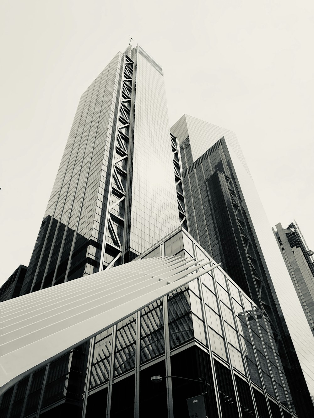 greyscale photography of high-rise building