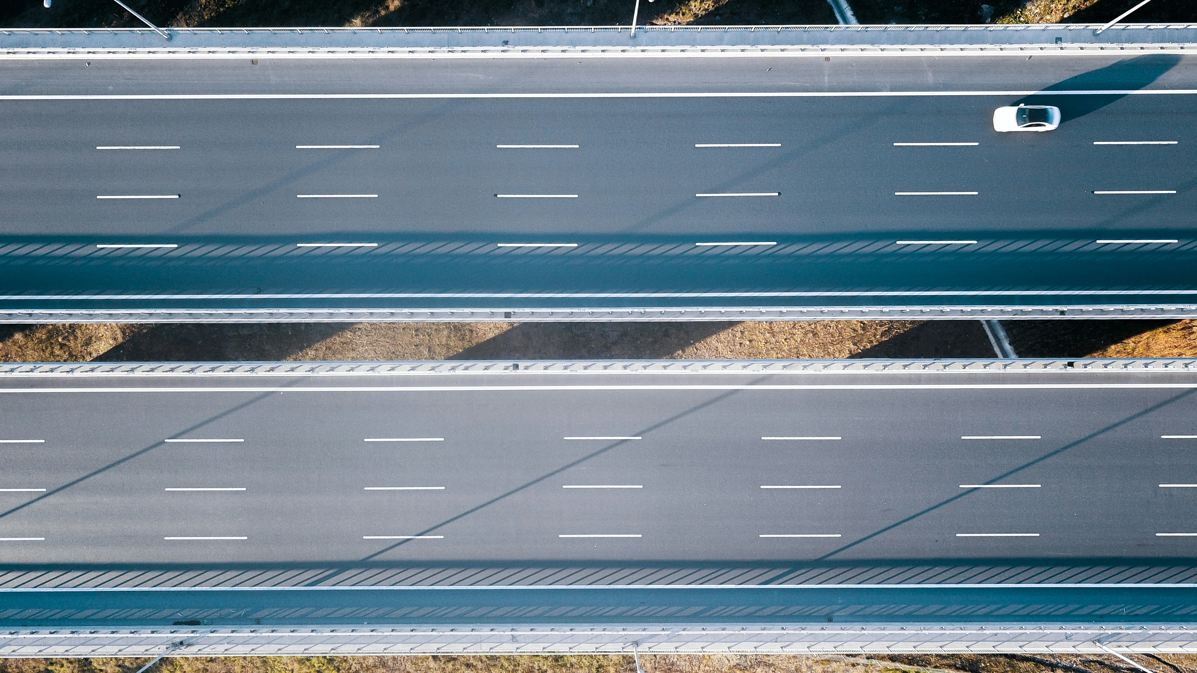 Closeup of an electric car dashboard screen showing battery charge level and remaining range