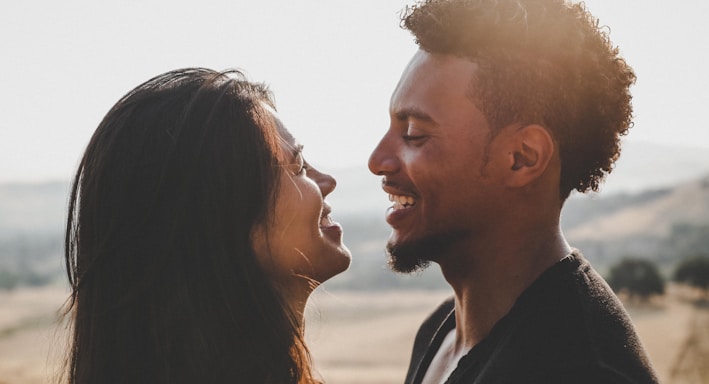 man and woman facing