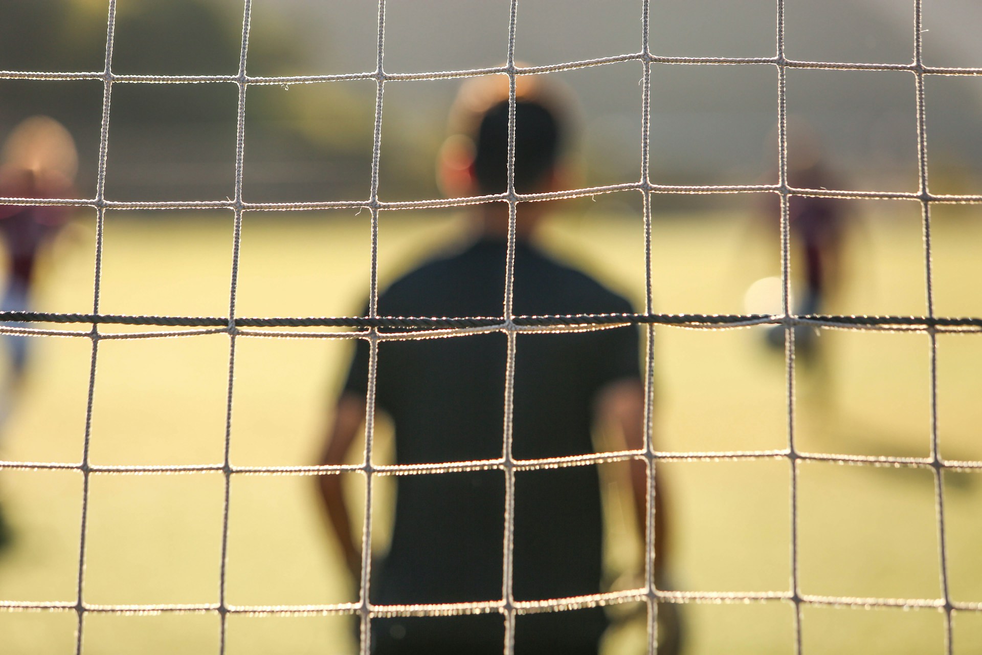 man standing near the goal post