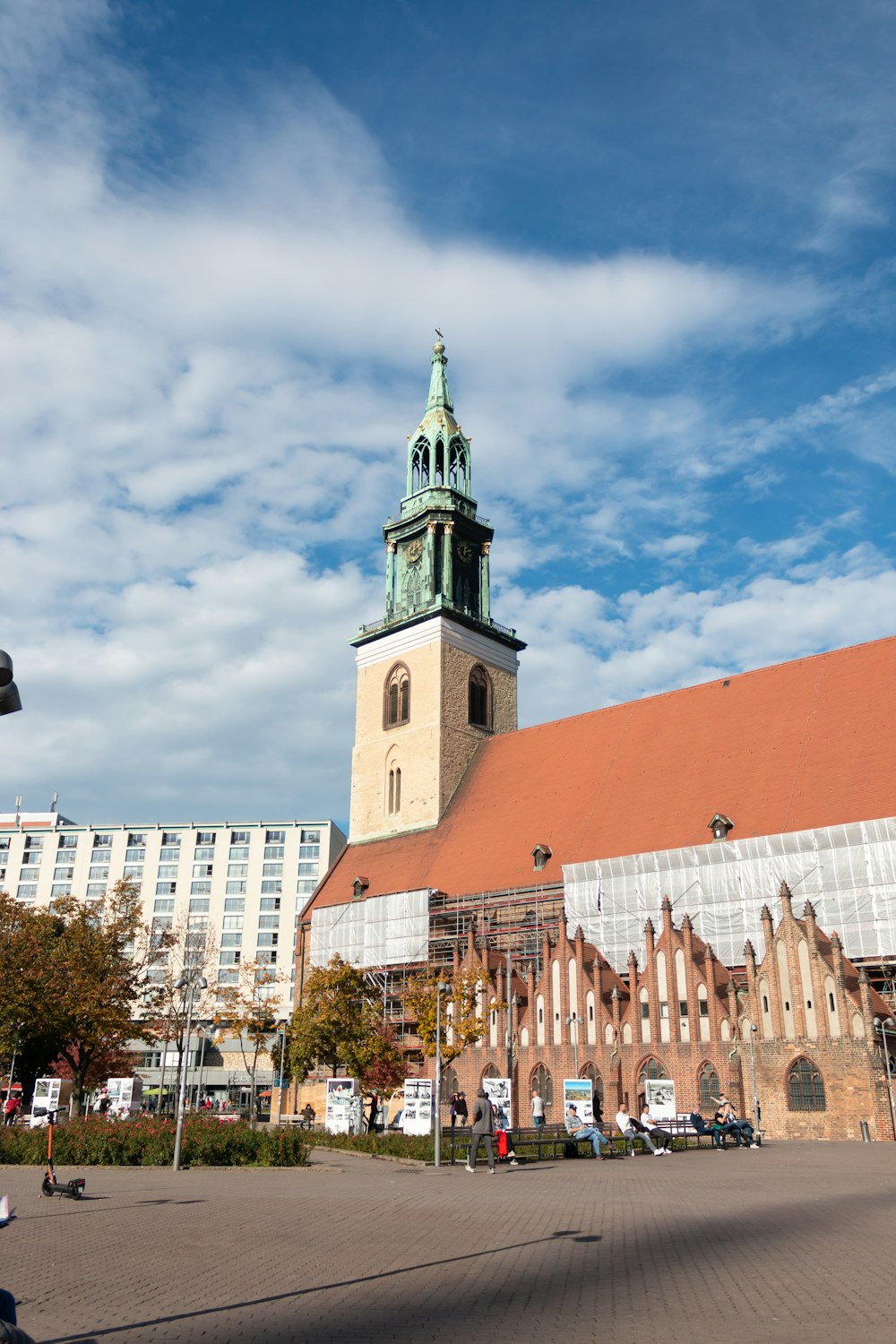 white and brown concrete building with tower during daytime