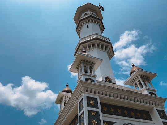 low-angle photography of white and brown tower in Kapitan Keling Mosque Malaysia