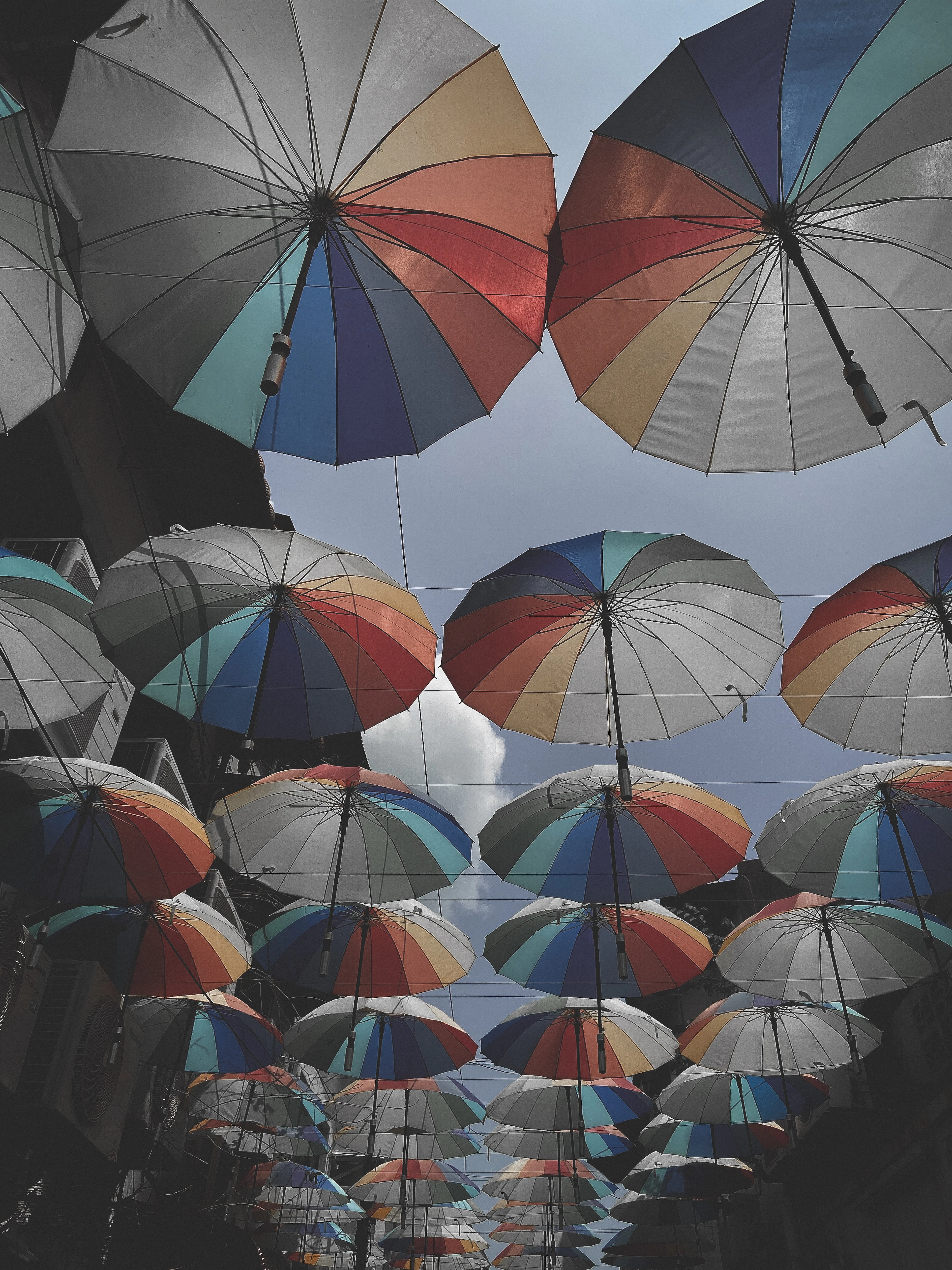 Colorful umbrellas suspended over a street in the George Town heritage quarter, Penang, Malaysia
