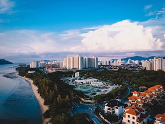 aerial photography of building beside body of water