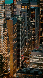 turned-on lights of high-rise building