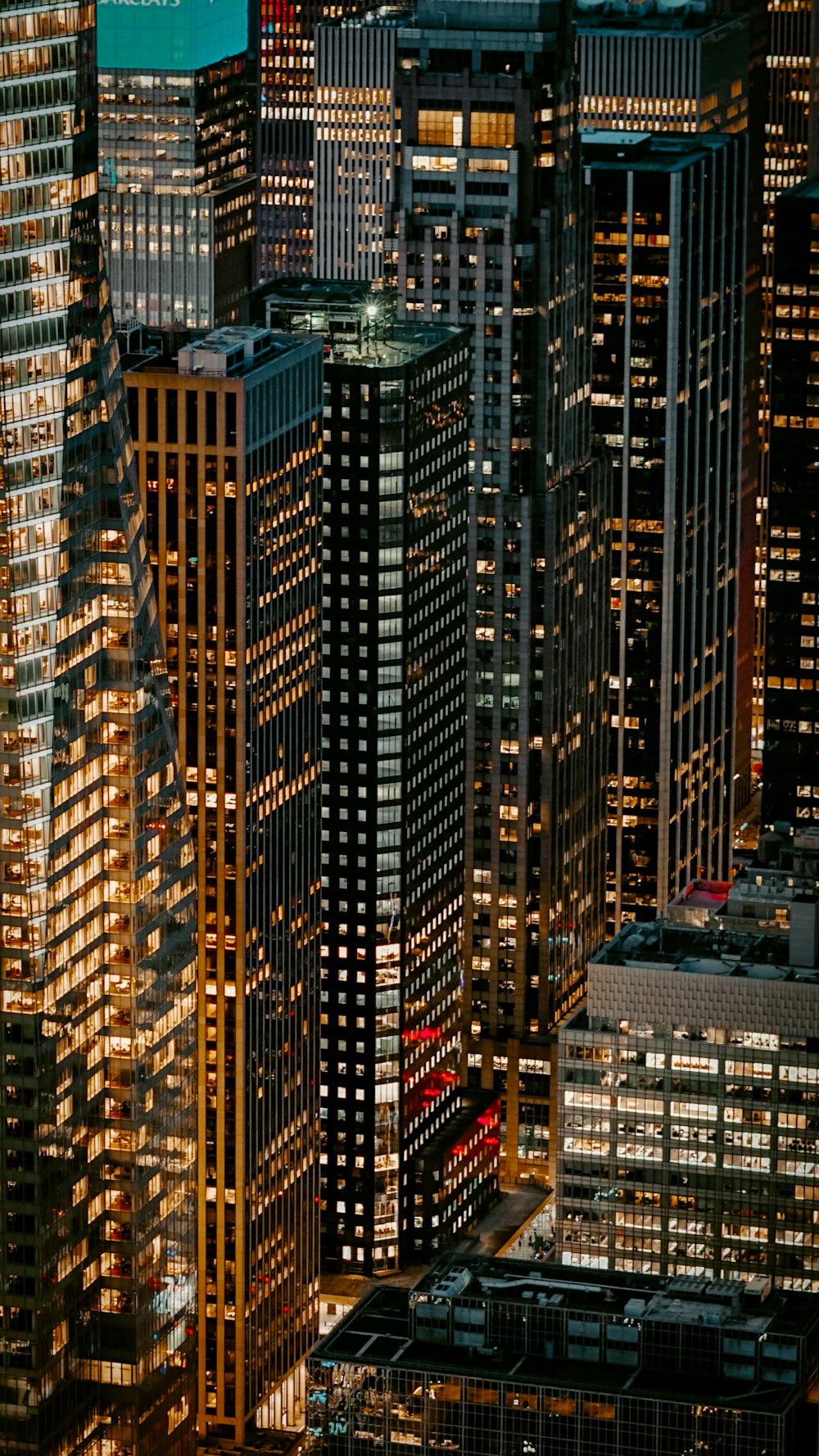 turned-on lights of high-rise building