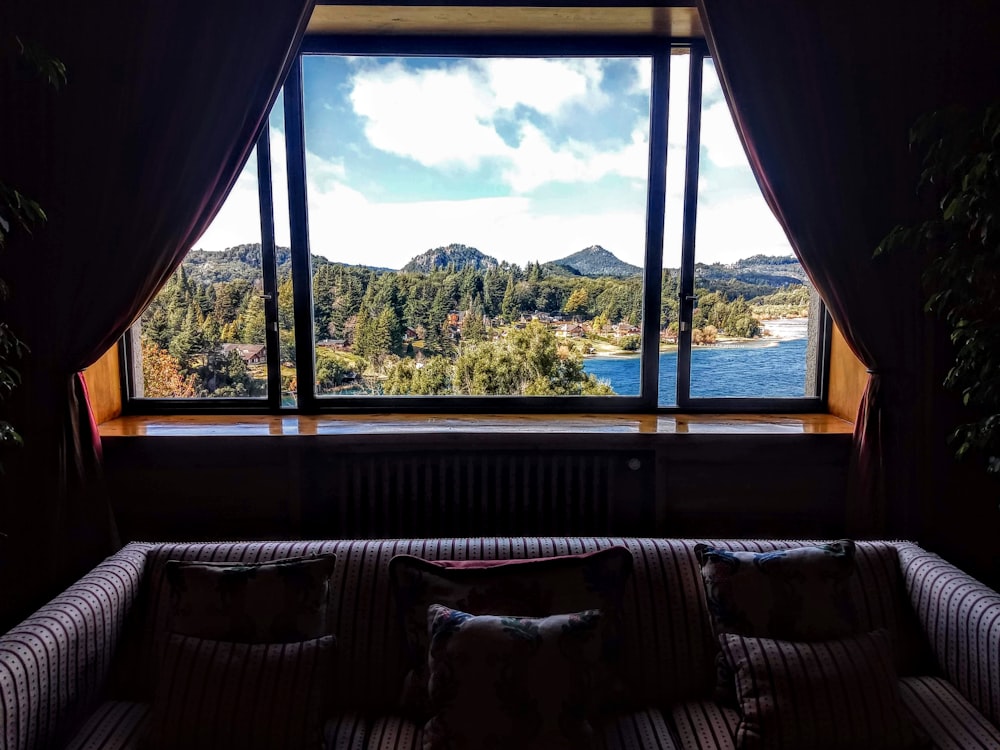 photo of gray couch and glass panel window