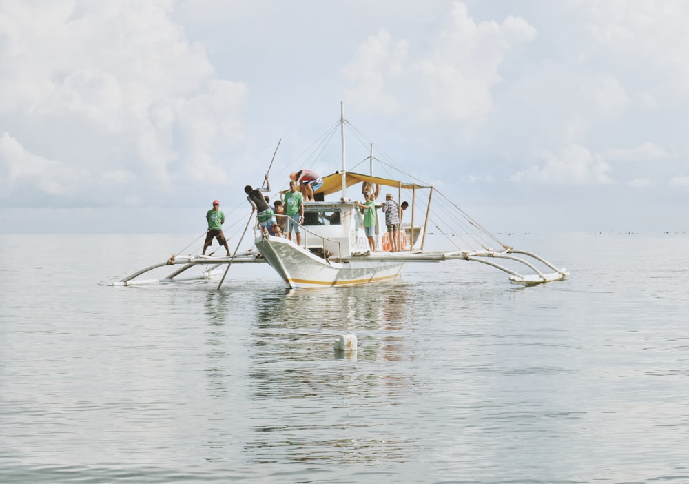 people on boat during at the ocean day