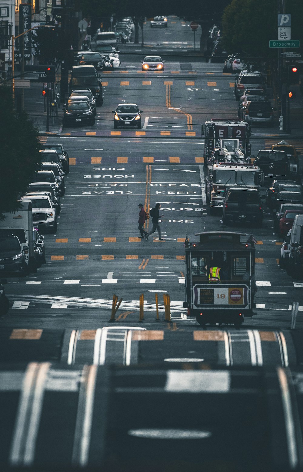 people crossing the road during day