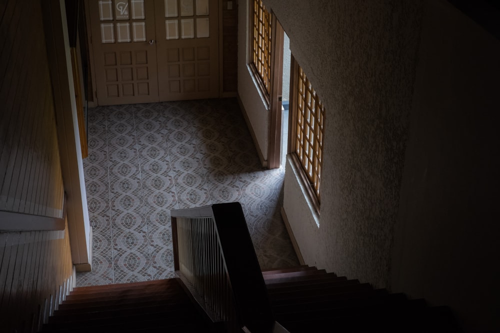 a staircase leading to a door and a window