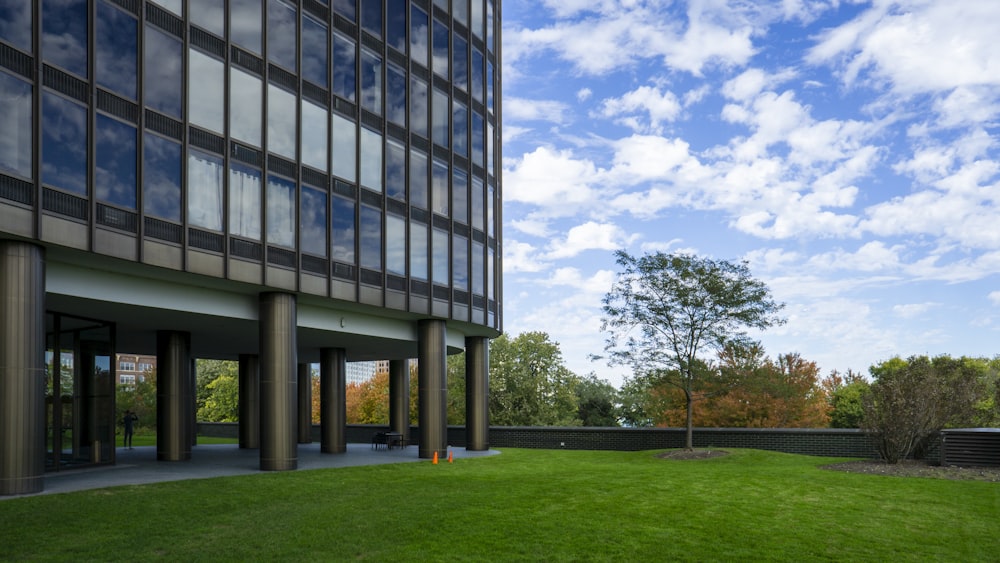 gray and brown painted building and grass field