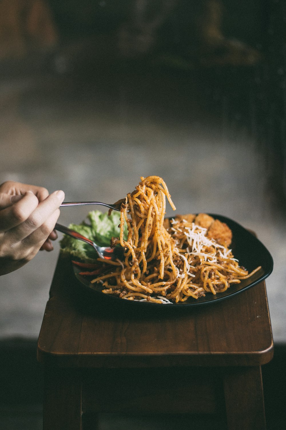 pasta dish on black ceramic plate