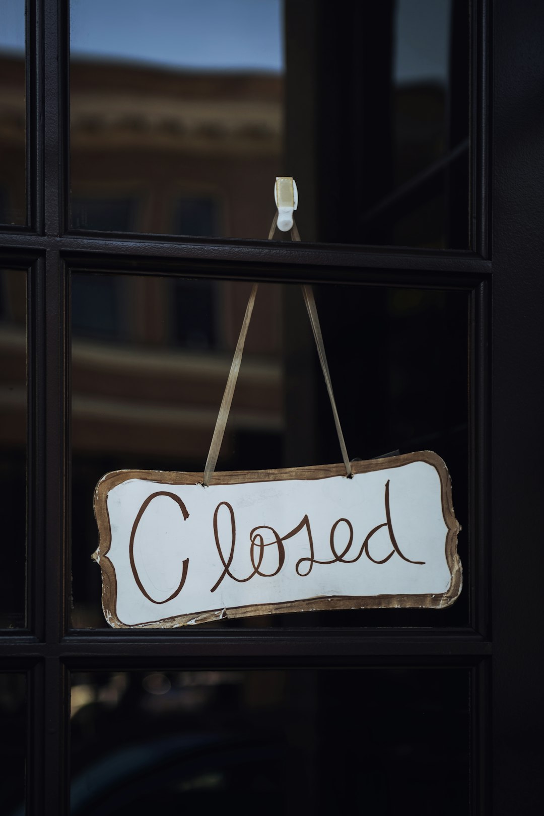 shallow focus photo of white closed signage