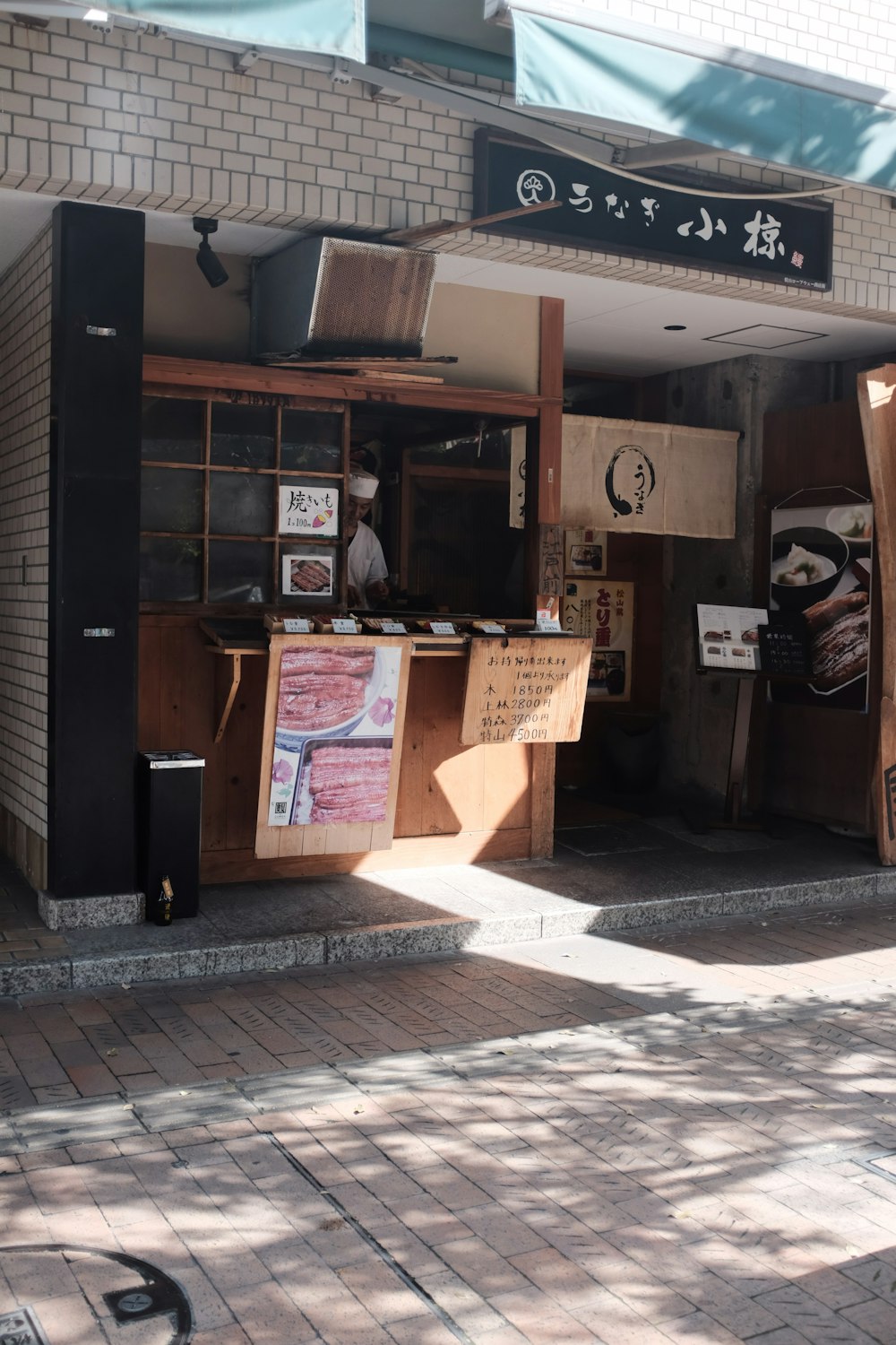 a store front with a bunch of signs on it