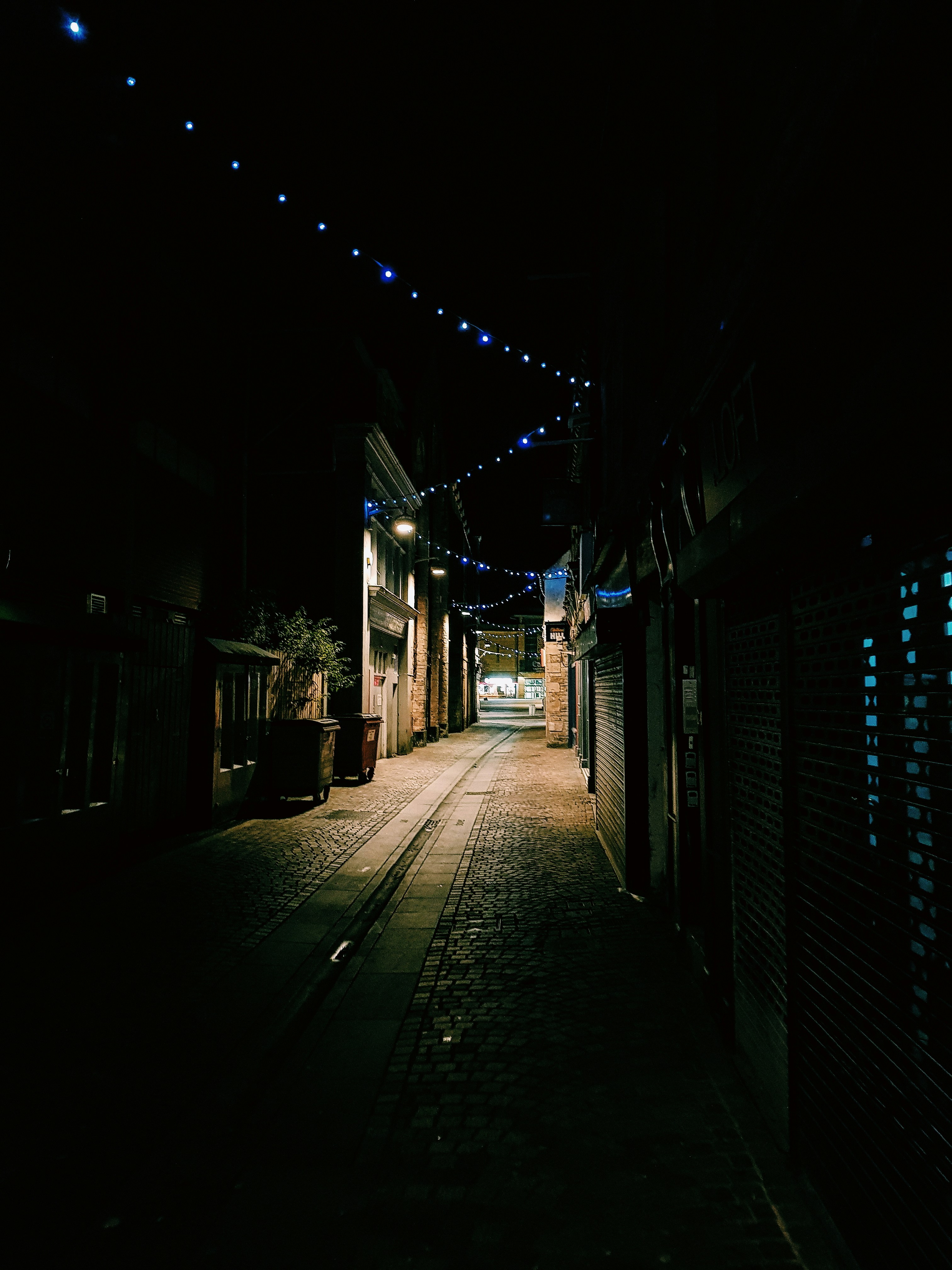 Empty Alley Between Houses And Stores At Night Photo Free Image On Unsplash