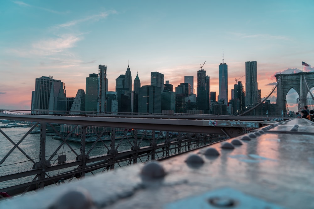 photo of gray building and bridge