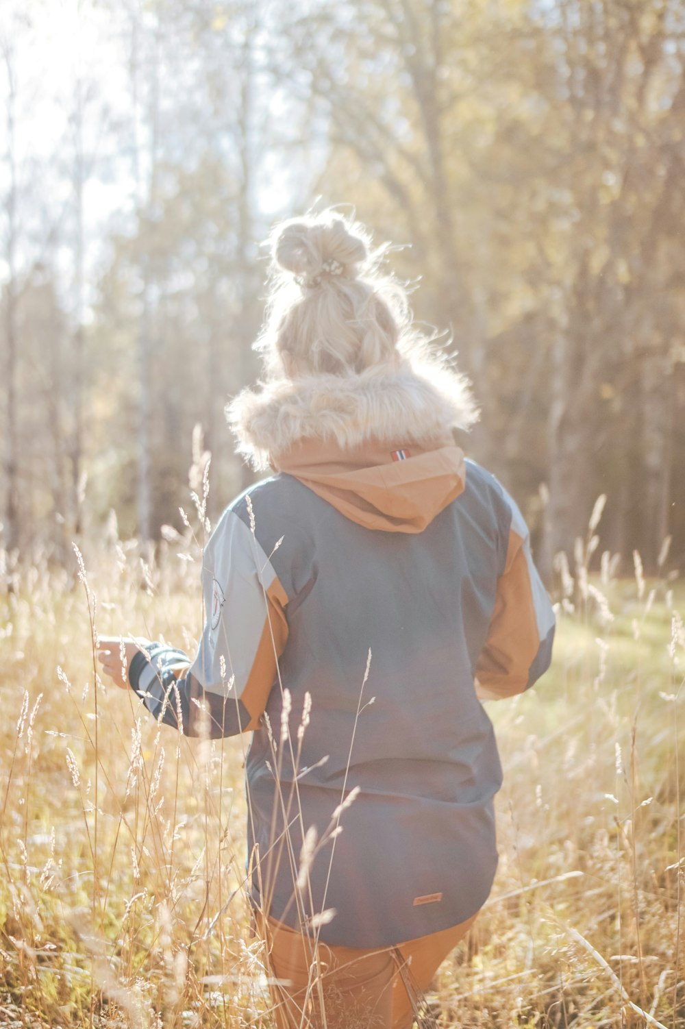 woman wearing green and brown hooded jacket