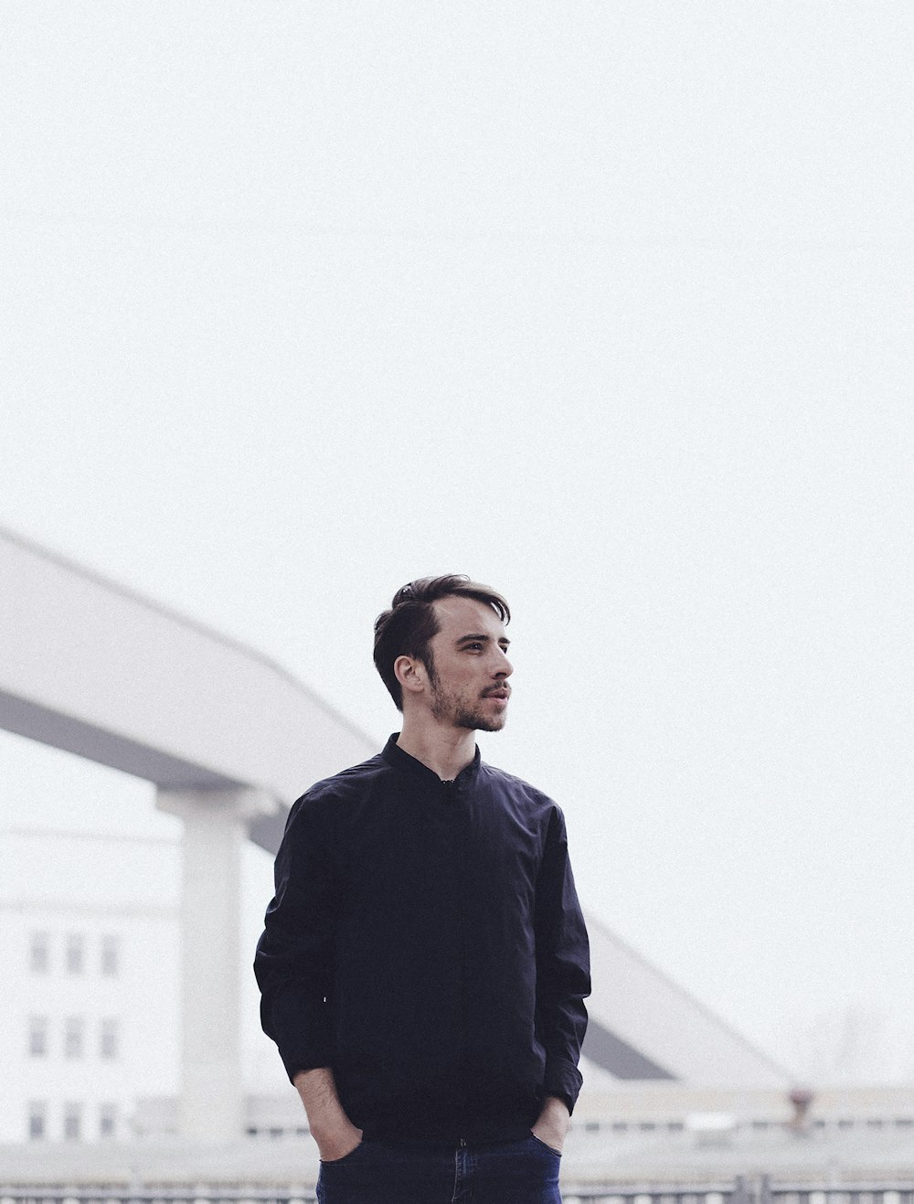 shallow focus photo of man in black dress shirt