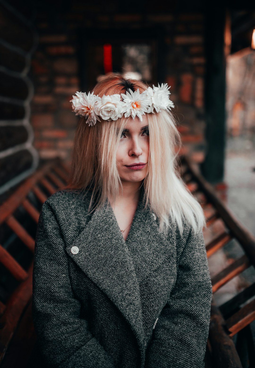 shallow focus photo of woman in gray coat