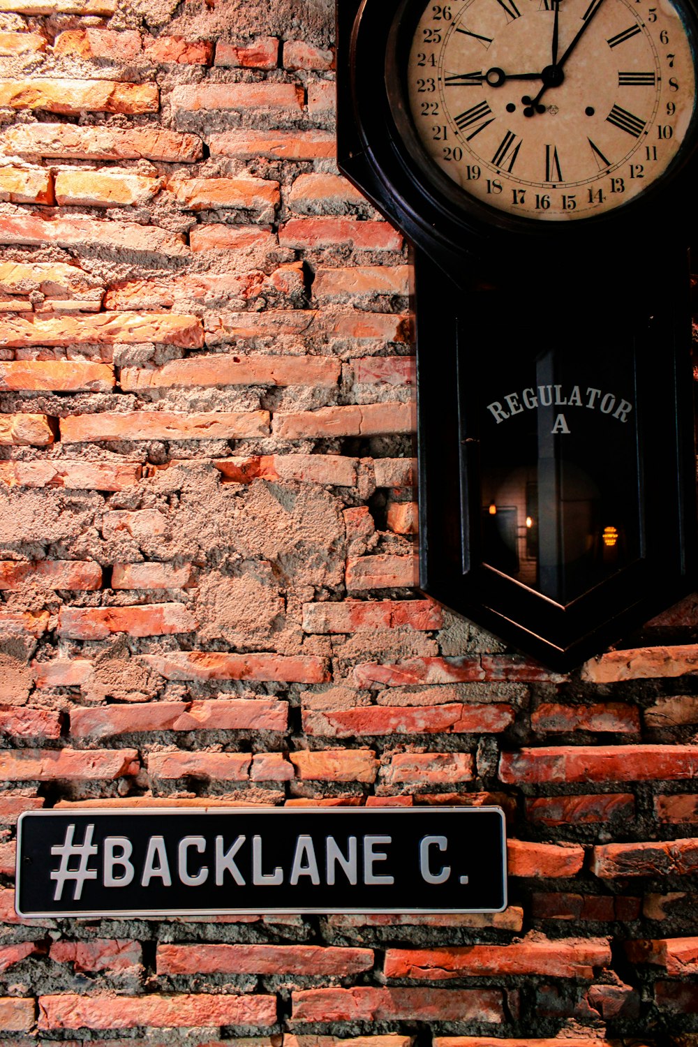 Backlane signage on brick wall
